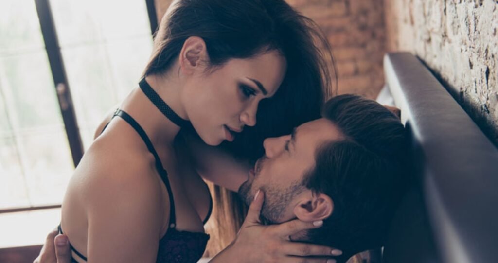 Elegant escort woman whispering in man's ear during intimate session in Amsterdam